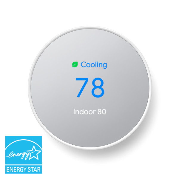 Google Nest Smart Thermostat in snow white, featuring a minimalist design and a circular touchscreen interface for intuitive temperature adjustments.